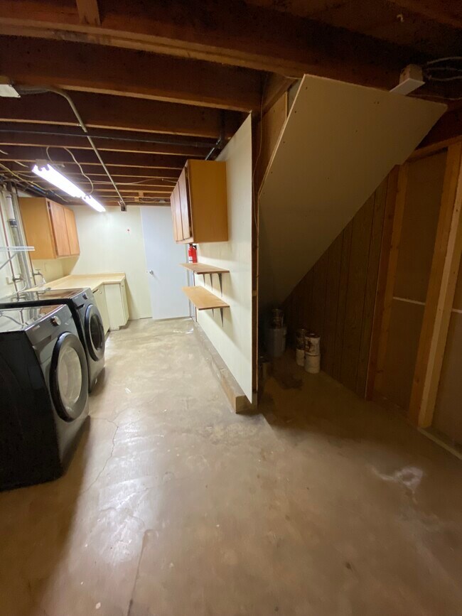 Laundry room with under stairs storage - 8430 Goodview Ave S