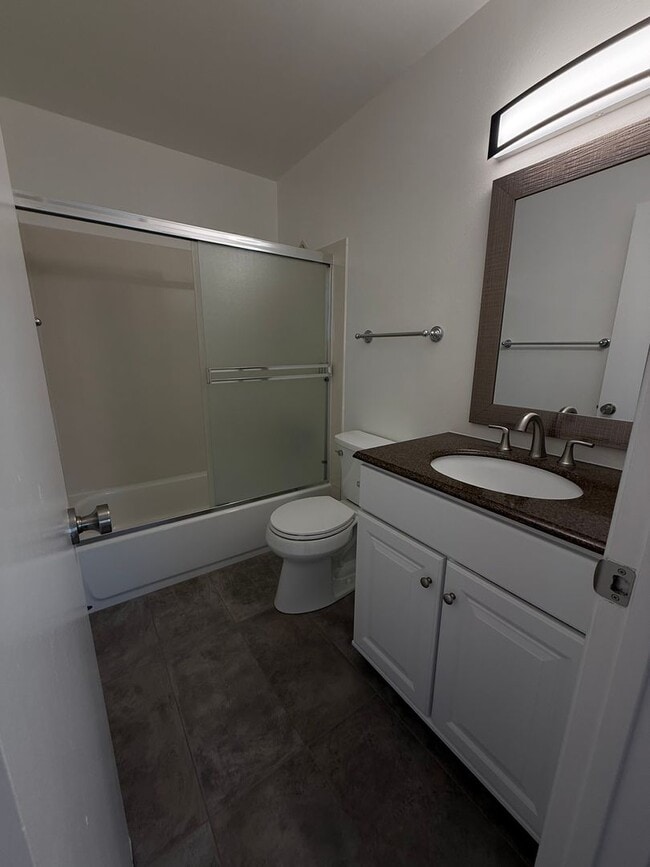 Building Photo - Recently updated home with new floors, paint & bathroom!