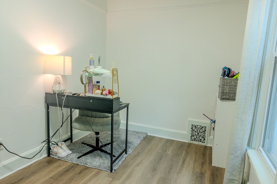 Bedroom #2 filled with natural light from large windows. - 1534 N Marshall St