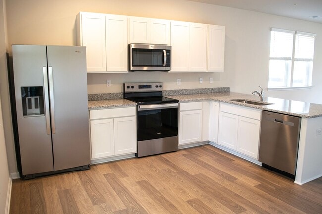 Building Photo - Stunning Brand New End Townhome