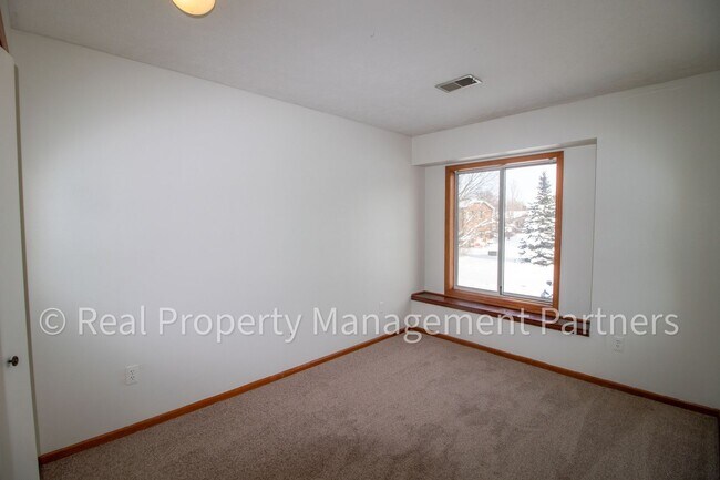 Building Photo - 2-Bed, 1-Bath Upper Unit with Garage & Porch – Steps from Paul Henry Trail