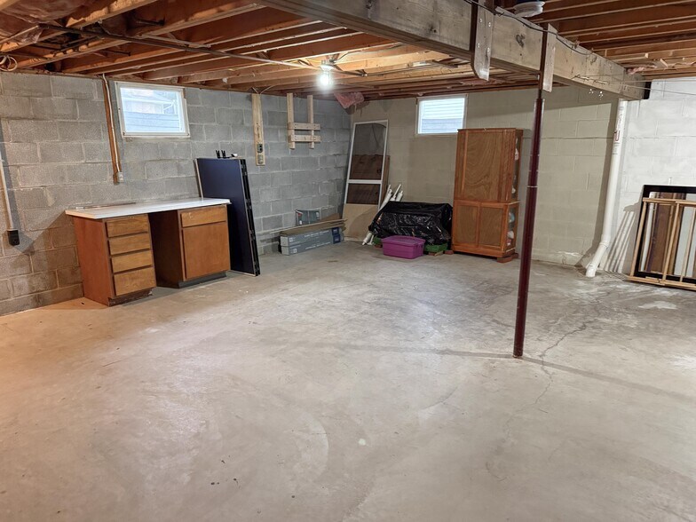unfinished half of basement - 304 Madison St