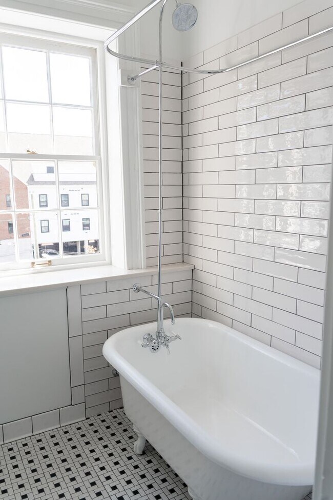 Building Photo - Renovated One-Bedroom Gem Steps from Train, Dining & Shopping