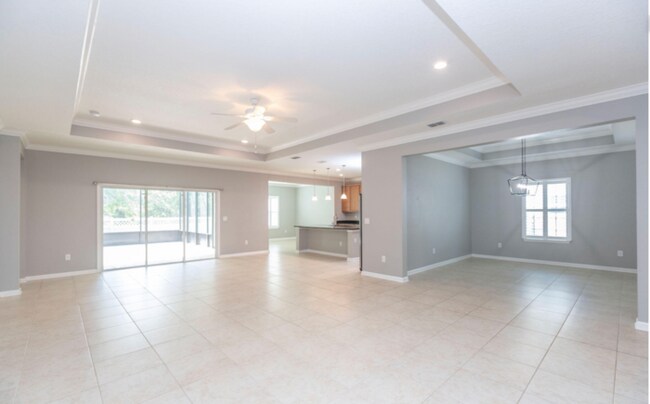 Building Photo - COMING SOON! Beautiful 4BR 3BA Home w/ Screened Lanai & Pond View • Garage Parking • Fenced Yard ...