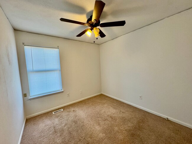 Building Photo - Spacious end unit townhome with first floo...