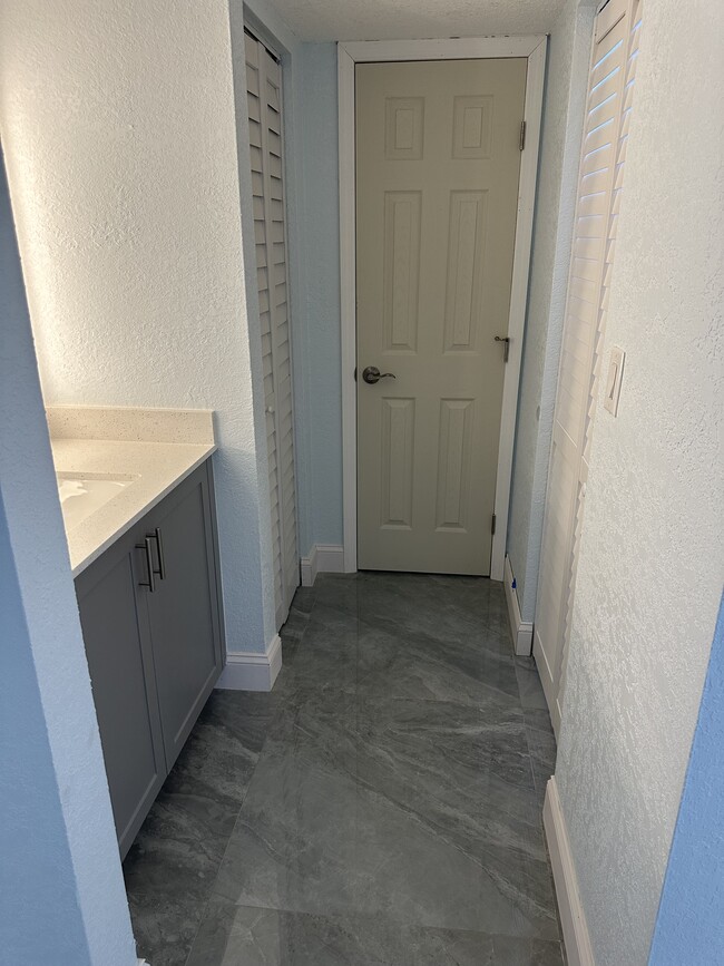 Master bedroom hallway to batroom - 8004 SW 149th Ave