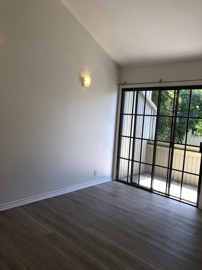 primary bedroom with balcony and walk-in closet - 3644 Villa Terrace