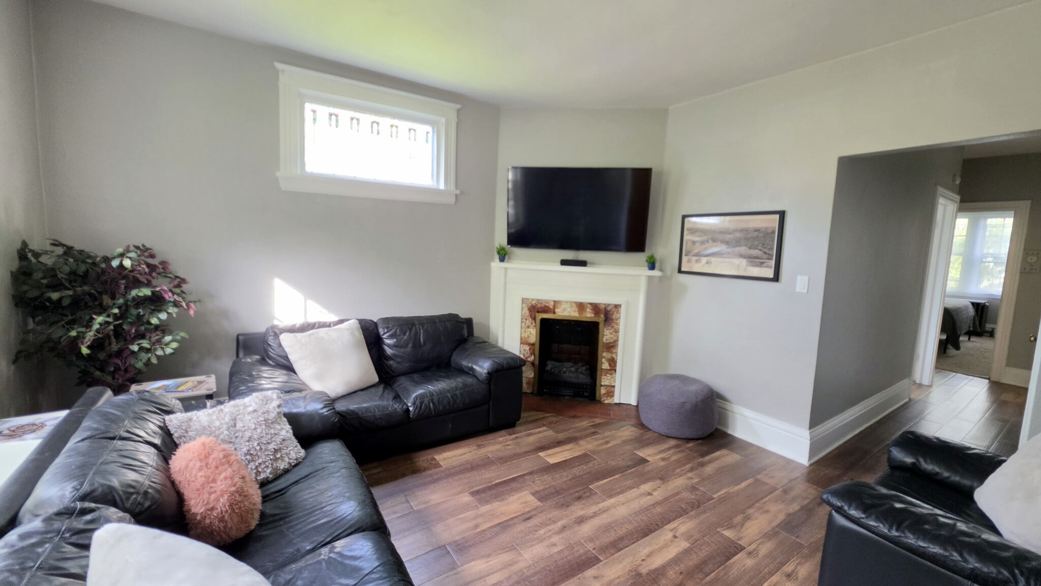 Another view of the spacious living area with easy access to both bedrooms. - 822 E 4th St