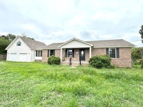 Building Photo - Spacious 4-Bedroom Home with Bonus Suite i...