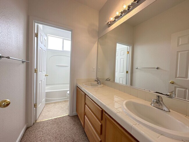 Building Photo - 4 bedrooms, 2 1/2 Baths with a 3 Car Garag...