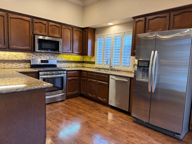 Building Photo - Immaculate home with pool & hardwood floors!