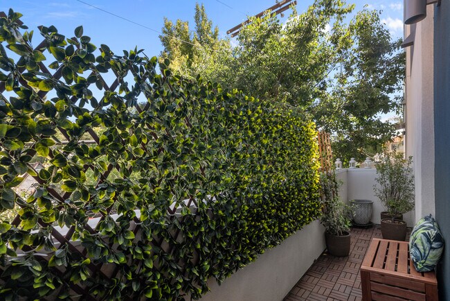 2nd floor balcony, now has updated privacy screen - 4831 Craner Ave