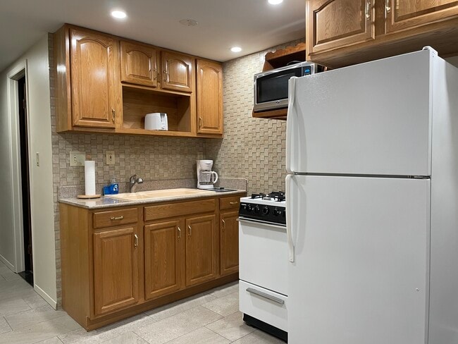 Full kitchen setup including dishes, glassware, silverware, pots, pans and small appliances included - 6030 NY-23