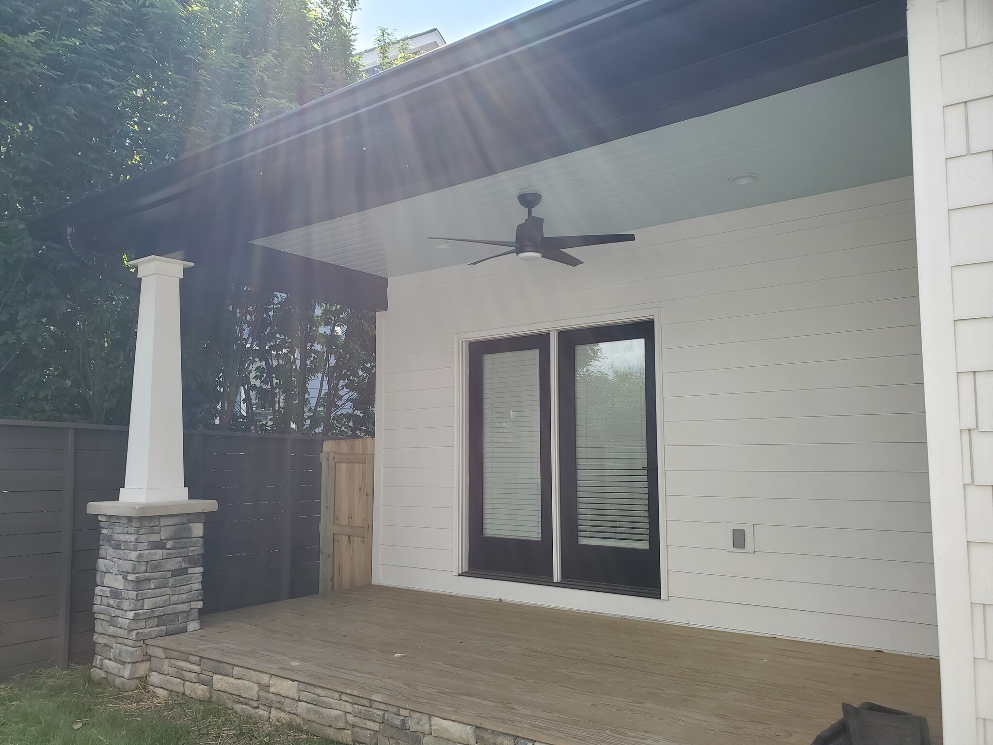 Back patio is covered and has a ceiling fan for year-round enjoyment. Also a fun blue ceiling! - 1021 Cheatham Pl