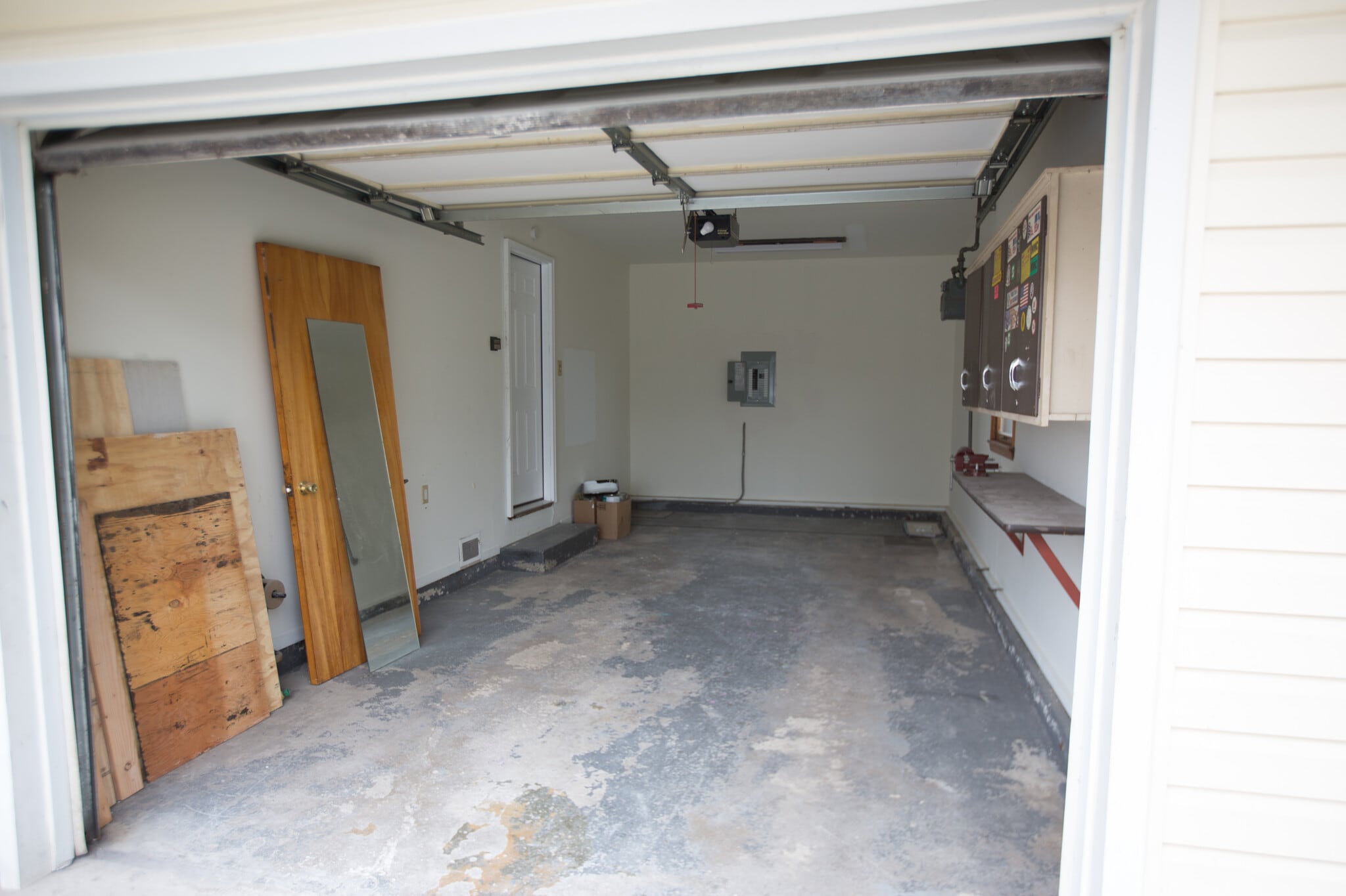 1 car garage with storage shelving on the right and storage opportunity in the back with this deep attached garage. - 18909 Lorenz Ave