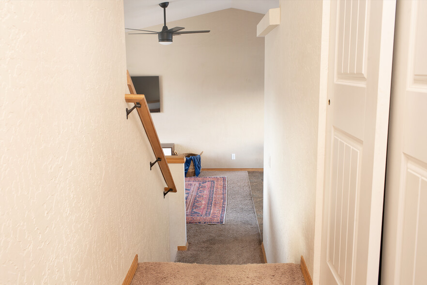 Main Hallway view with Hall Closet and shelving - Tri Level - New Area rug in Dec 2023 - 2805 W Dumont Dr