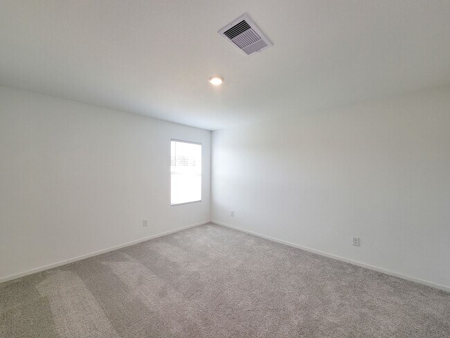 Building Photo - This single-level home showcases a spacious open floorplan shared between the kitchen, dining are...