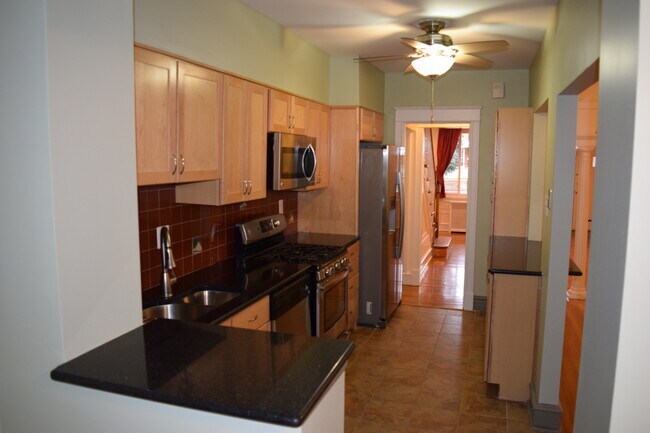 Building Photo - Regal Rowhome! 3 Beautiful Finished Levels!