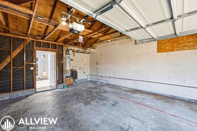 Building Photo - Fully Renovated 2 Bed Townhome with Private Patio, 2-Car Garage & Community Pool