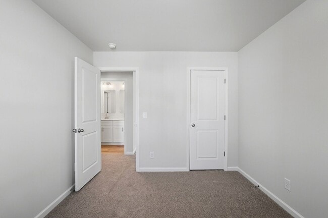 Building Photo - 4BR Home in The Pines at Paw Creek – New Construction + Private Deck