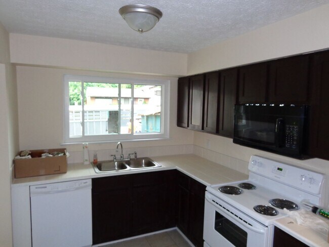 Primary Photo - Spacious 3-Bedroom Split-Level Home with L...