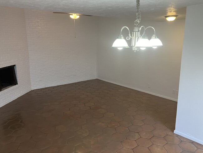 Spacious living space with gas burning fire place, new fixtures and cozy saltillo tile - 13559 Red Fern Ln