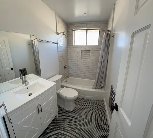 Newly renovated bathroom with custom finishes. - 1016 Western Ave