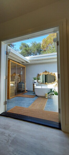 Swing open your glass French doors to your private spa oasis - 603 Sunset Dr