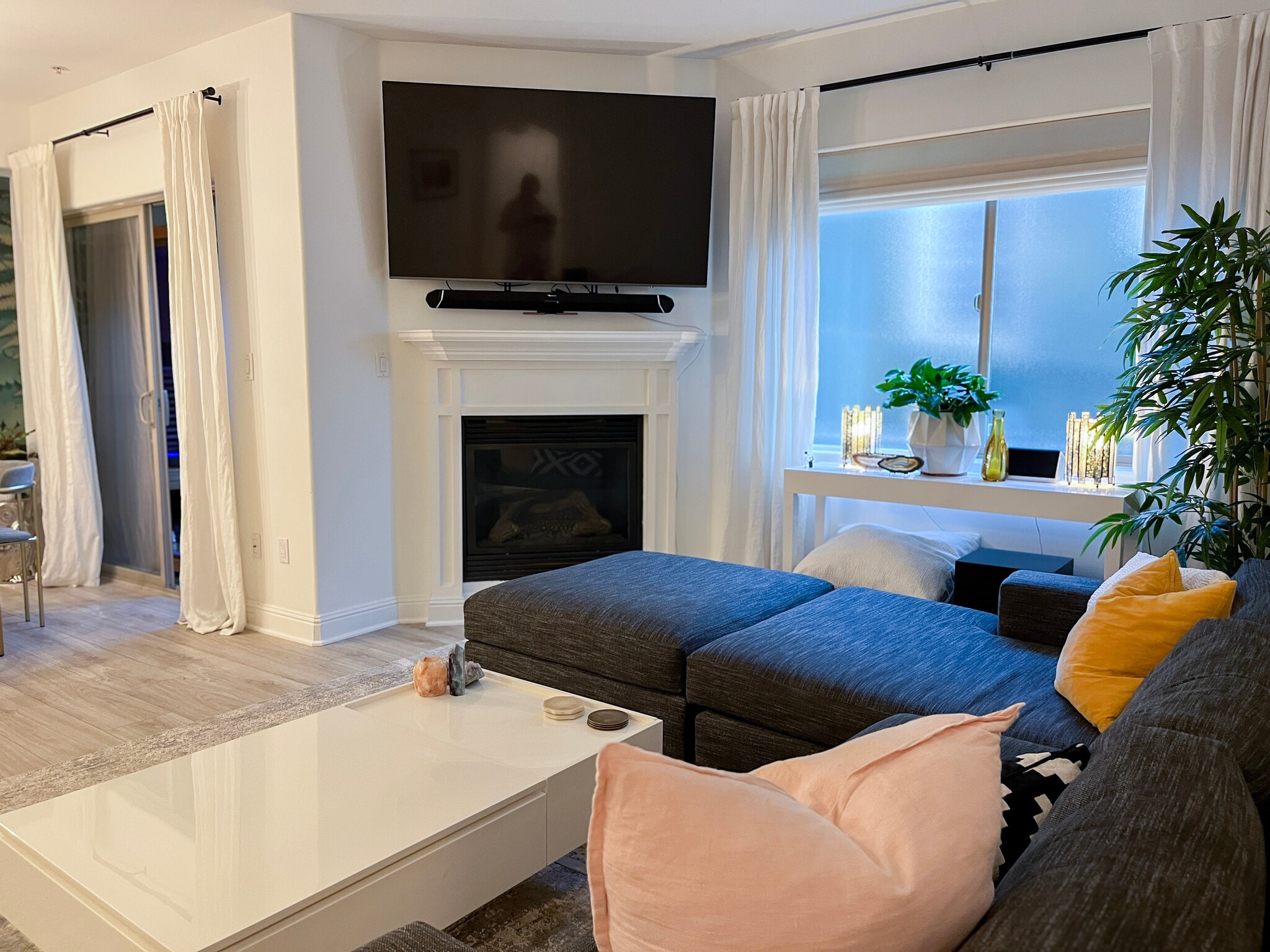 TV is on an adjustable arm that can be lowered in front of the fireplace for a better viewing angle - 5037 Rosewood Ave