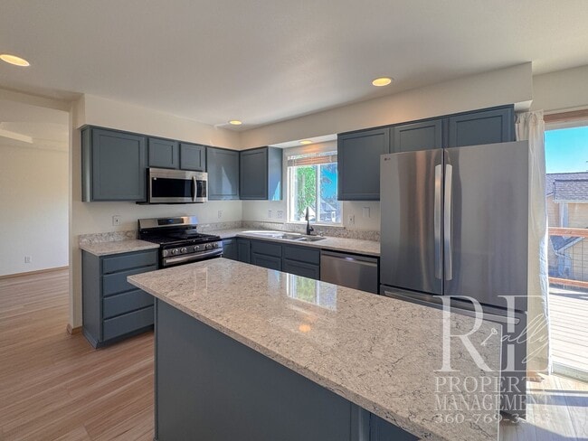 Building Photo - Immaculate Bremerton Home with Expansive Yard, Multiple Living Areas & Designer Kitchen