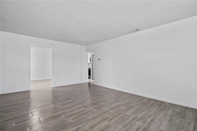 Building Photo - 3100 Coral Springs Dr