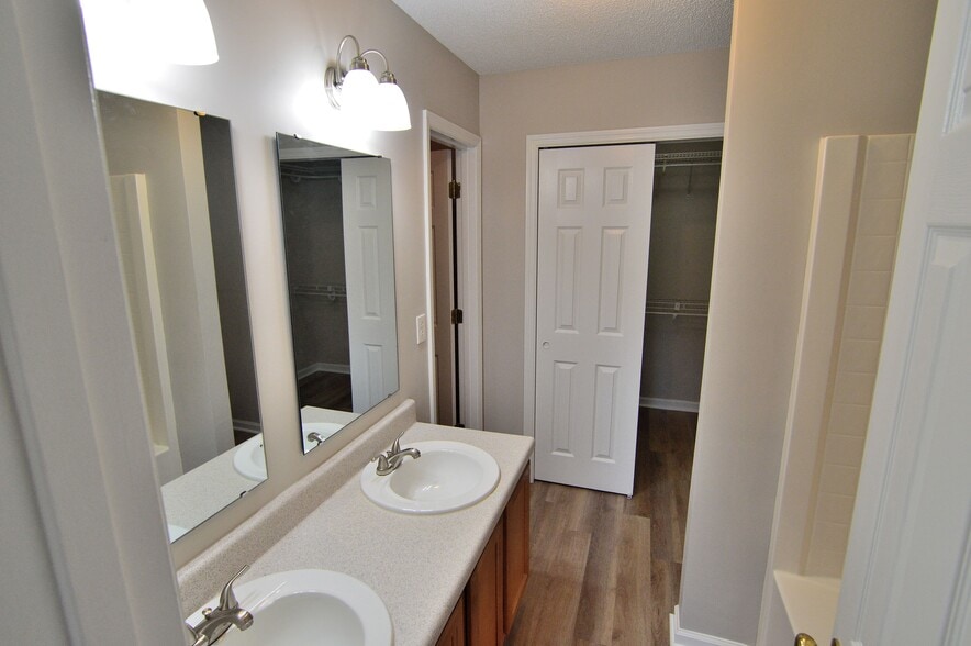 Primary bathroom has 2 walk-in closets - 203 Hawkridge Pl