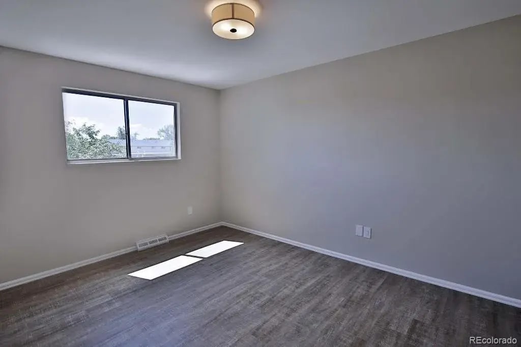 2nd Bedroom with closet and ceiling fan (upgraded ceiling fan not pictured) - 7504 W Quarto Ave