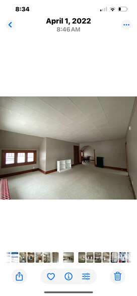 Large living room with partial view of West Bay. - 810 E Front St