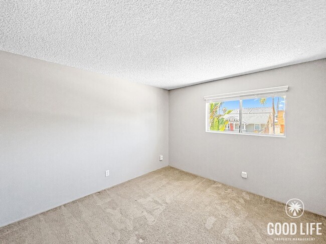 Building Photo - Comfortable 1BD/1BA Upper-Level Condo in North Park with Reserved Parking & On-Site Laundry