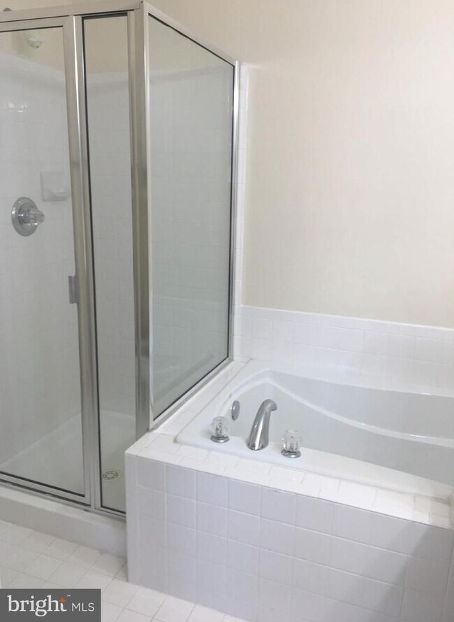Building Photo - Welcome to this beautifully appointed two level upper condominium that combines modern style with...