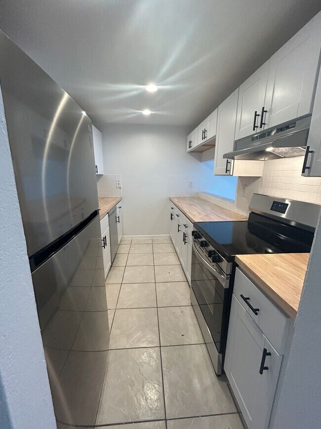 Building Photo - Now Leasing - Two bedroom condo with a pri...
