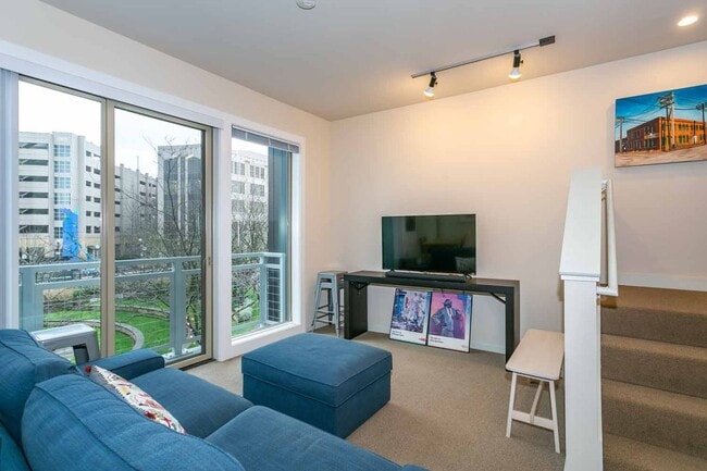 Building Photo - Gorgeous loft-style 2 floor condo with secured parking, A/C and rent includes most utilities!