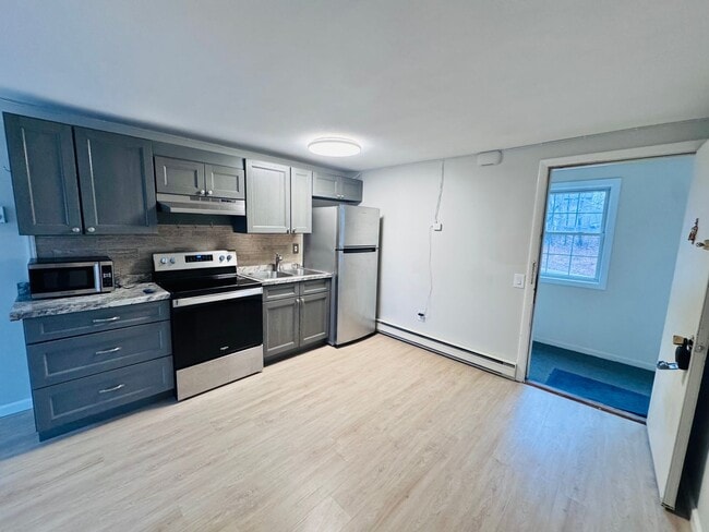 Building Photo - Price Improvement! $1500 Hot Water Included | Looking for the perfect studio in Dover with a pool...