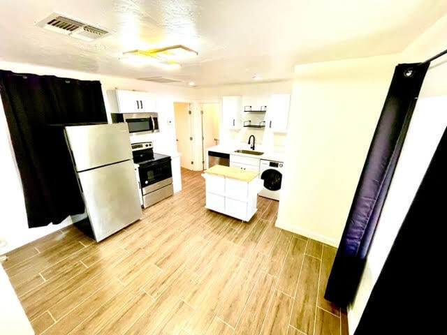 Building Photo - Renovated in the heart of Roosevelt district WITH LARGE PRIVATE GARAGE!!!