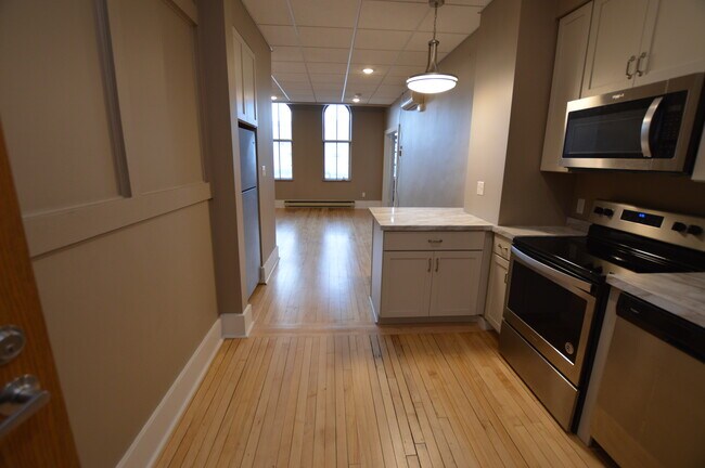 Beautiful wood floors and original windows - 604 Main Ave