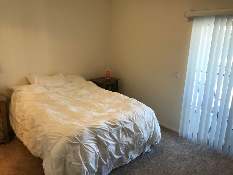 Master Bedroom with sliding door leading to a private balcony. Outdoor closet on Balcony. - 4154 N Thurston Ln