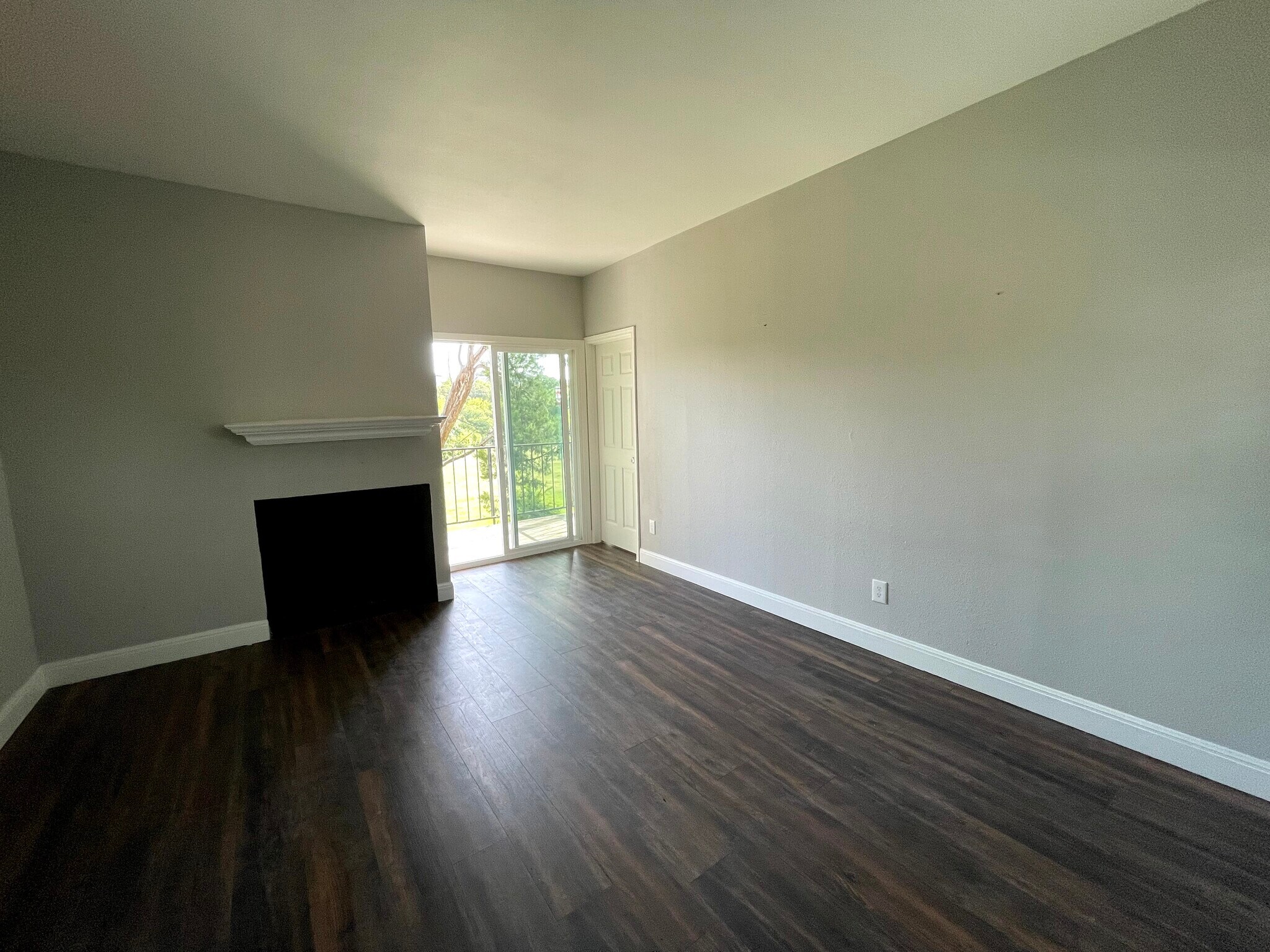Fireplace with mantle and large living room - 12166 Metric Blvd