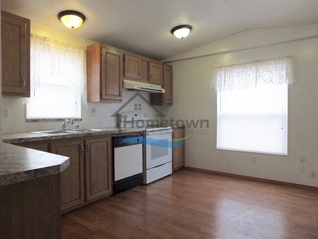 Building Photo - 2 Bed 1 Bath Mobile with Fenced Yard and Storage Shed!