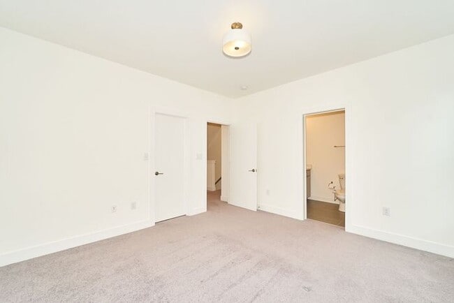 Building Photo - Like New Townhome With Your Own Rooftop Views of Downtown Indy!