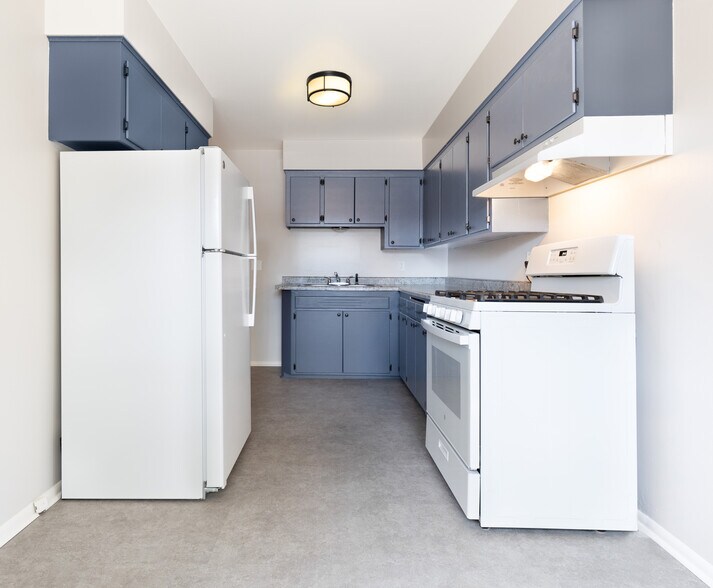 Beautifully updated cabinets, flooring, and light fixtures. Brand new gas stove and full-size fridge - 3118 28th Ave S