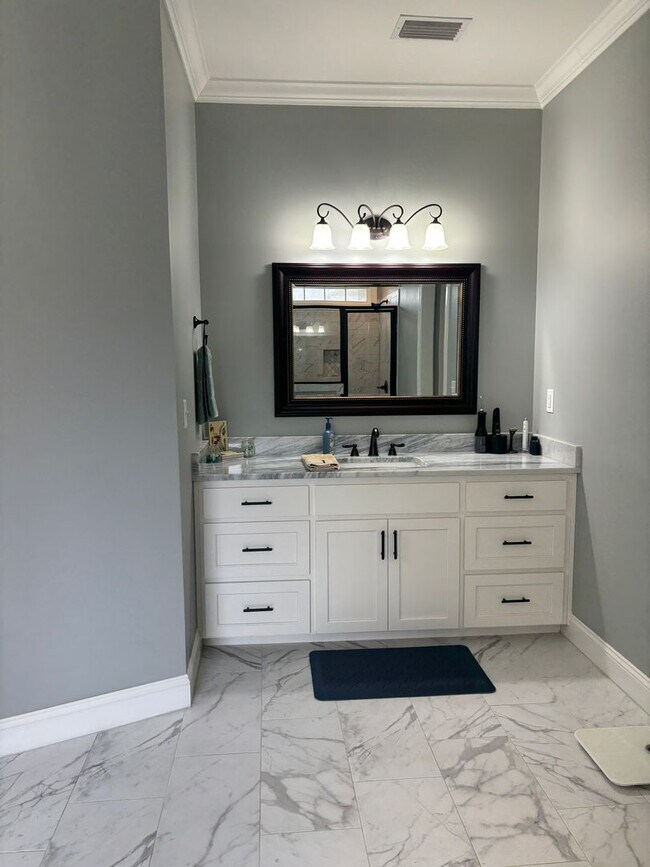 Building Photo - Spacious 4BR/3BA Creekside West Home with Screened Porch, Fenced Yard & 3-Car Garage