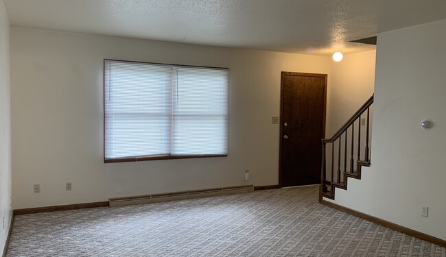 Lots of natural sunlight in this west facing unit. Home has it's own front and back doors. - 1320 5th St W