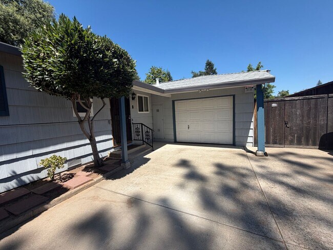 Building Photo - Adorable house with large deck,  yard and RV access