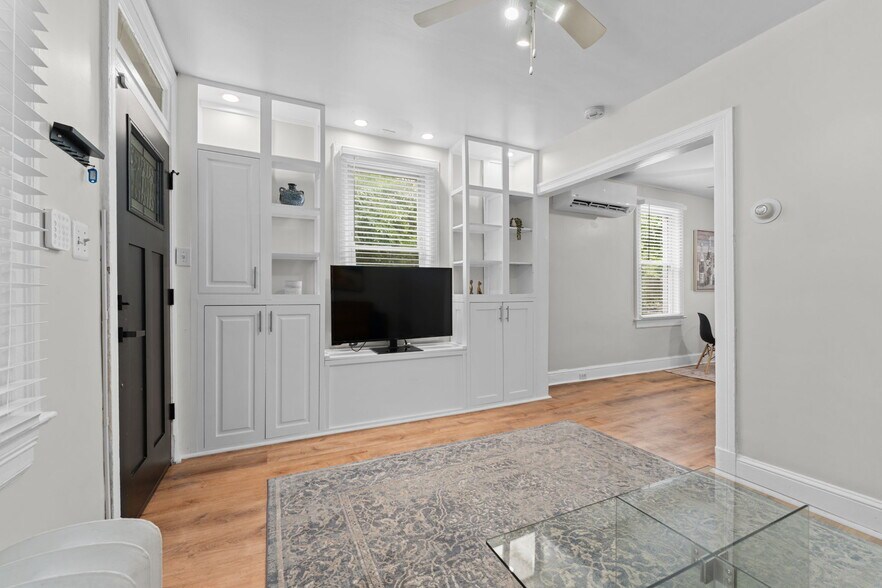 Living room has custom built-in open cabinetry - 2339 3rd St NE
